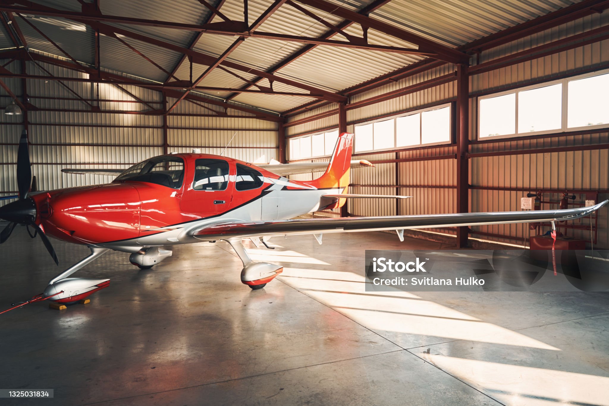 Red Plane in Hangar