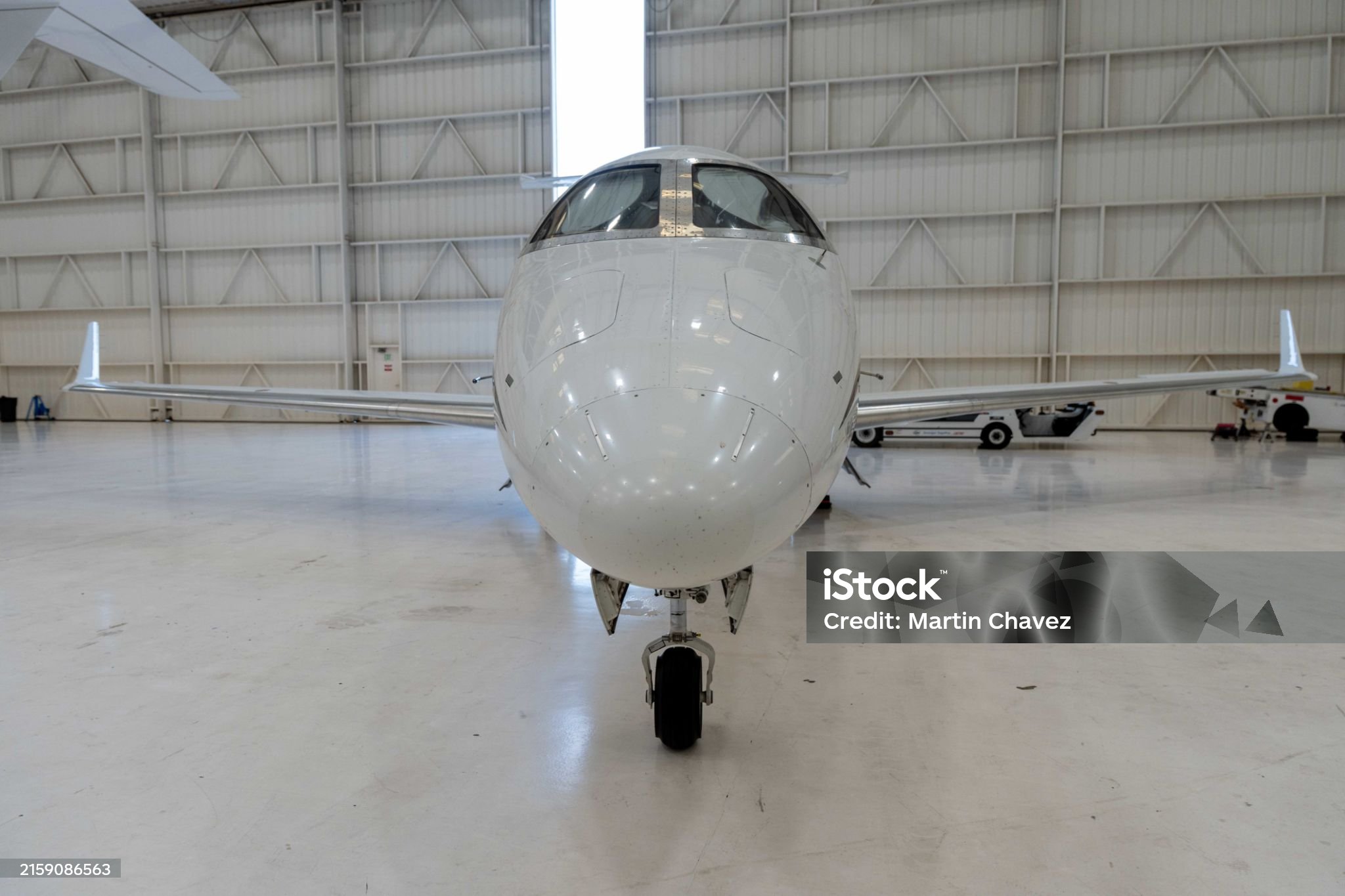 White Plane in Large Hangar